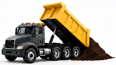 Same graphite dump truck unloading soil at a receiving site